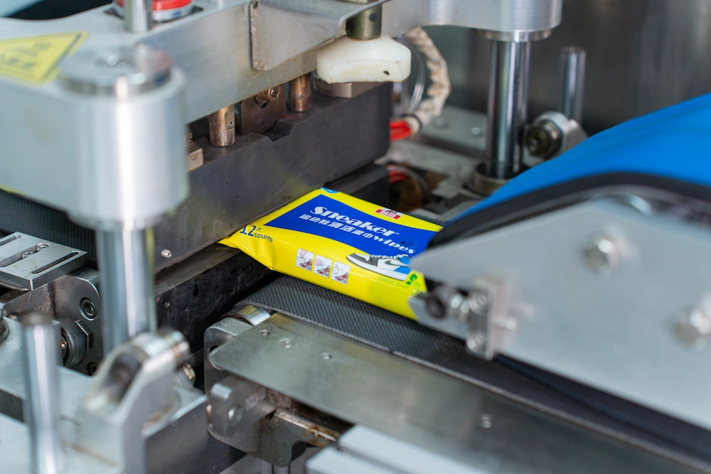 packs of sneaker wipes packed and assembled in a production line