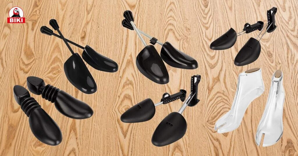 Diverse Biki Shoe Stretchers and Shapers for Footwear Care on Wooden Surface