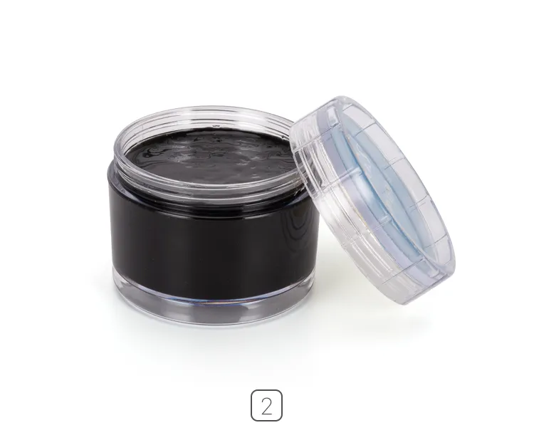 A jar of black solid shoe polish with its clear plastic lid partially removed, revealing the smooth black wax inside.