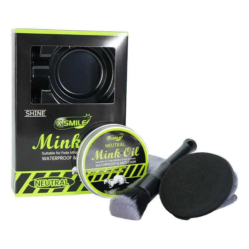 Complete OEM mink oil kit including a 100g tin, applicator brush, sponge, microfiber cloth, and a custom black retail box.